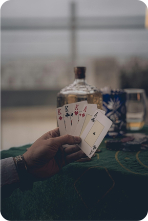 man holding cards in left hand